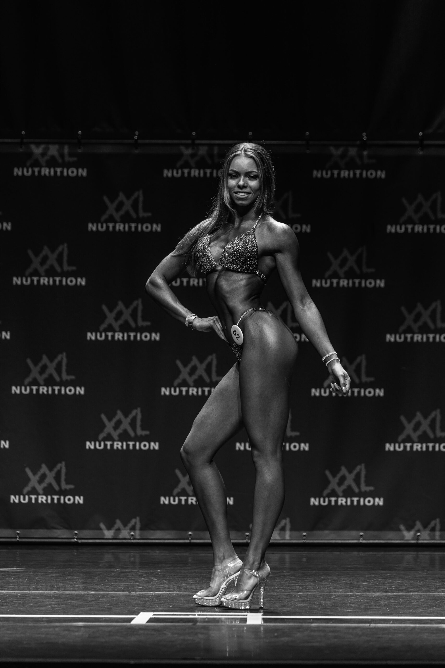A female competitor in the NPC Bikini division.